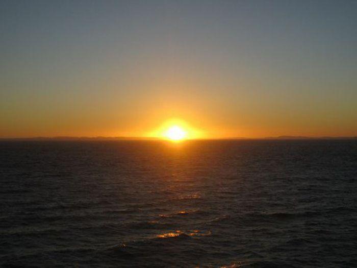 Sonnenuntergang ueber der Insel Chiloe